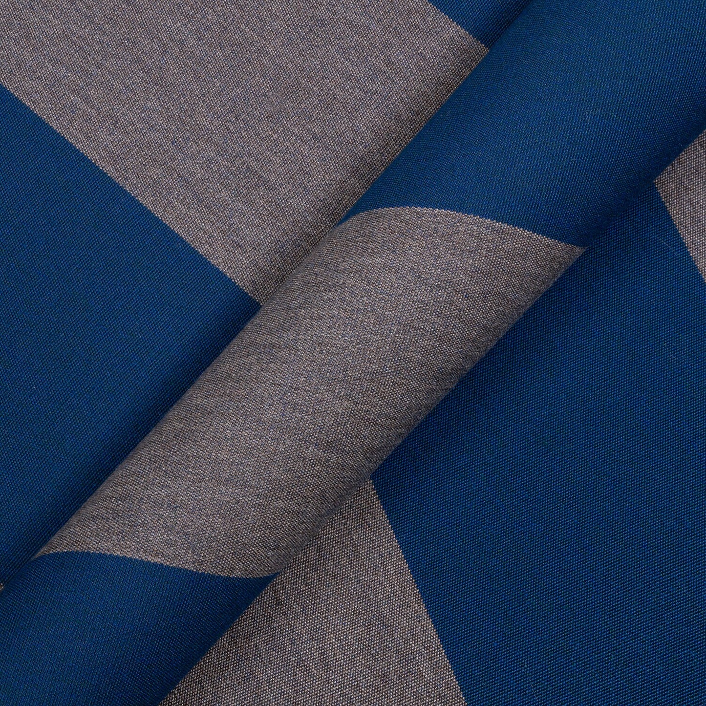 Close-up of blue and gray fabric with a geometric pattern
