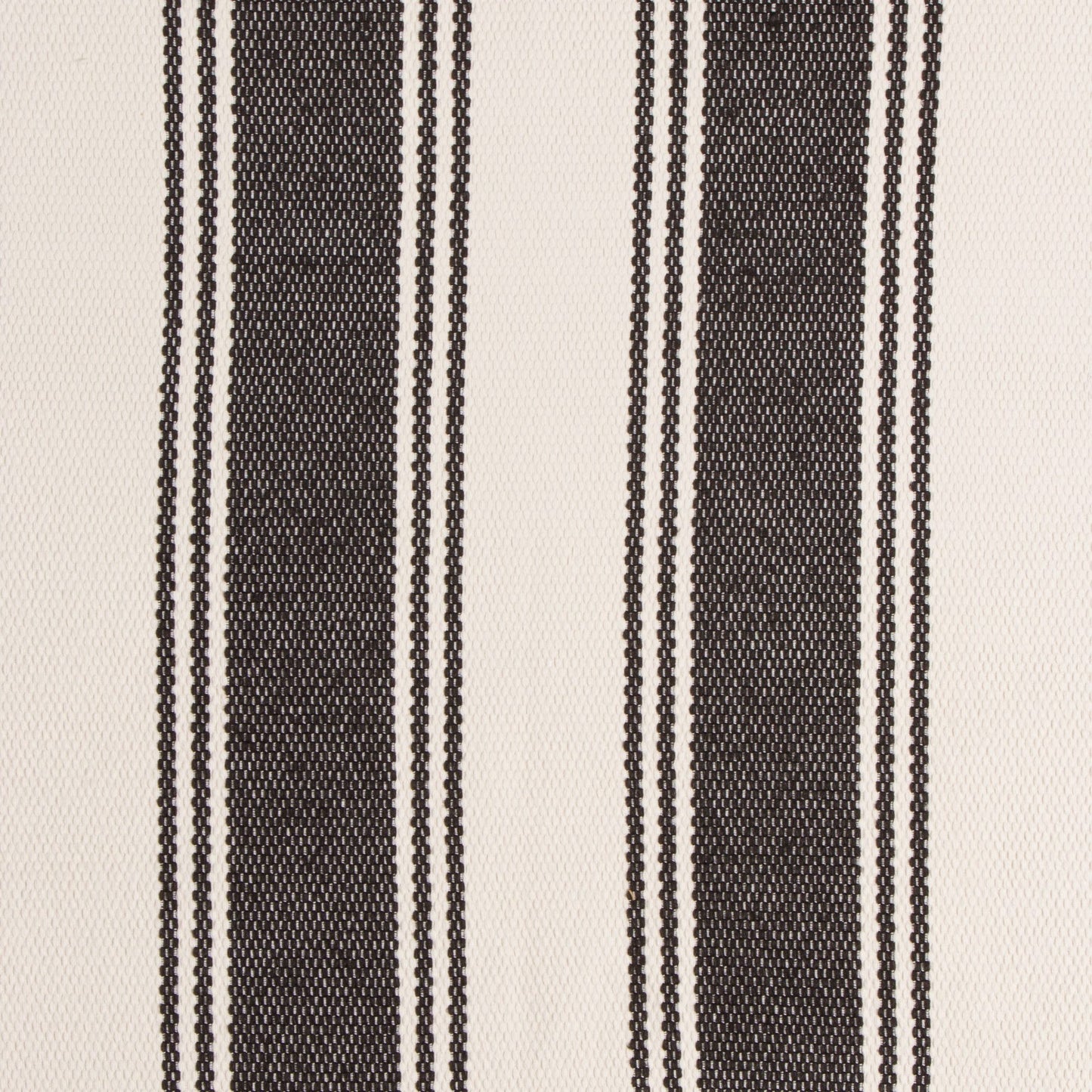 Textured fabric with black and white stripes on a beige background