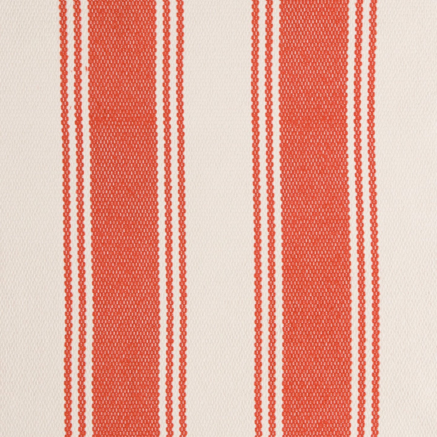 Fabric with red and white vertical stripes on a beige background