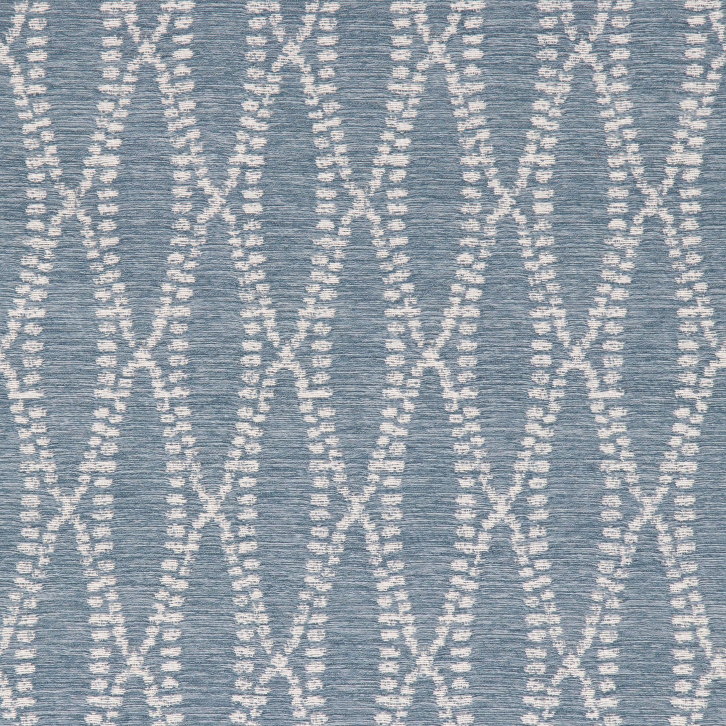 A close-up image of a blue chambray fabric with a textured pattern.