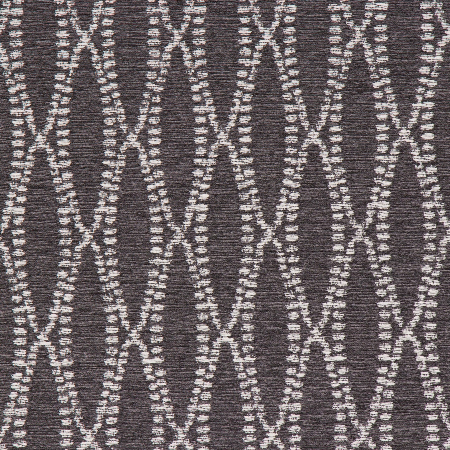 This image displays the texture and pattern of the "Camber Onyx" fabric. The fabric features a sophisticated, dark gray color with a geometric design composed of interwoven white lines that create a visually appealing negative space.