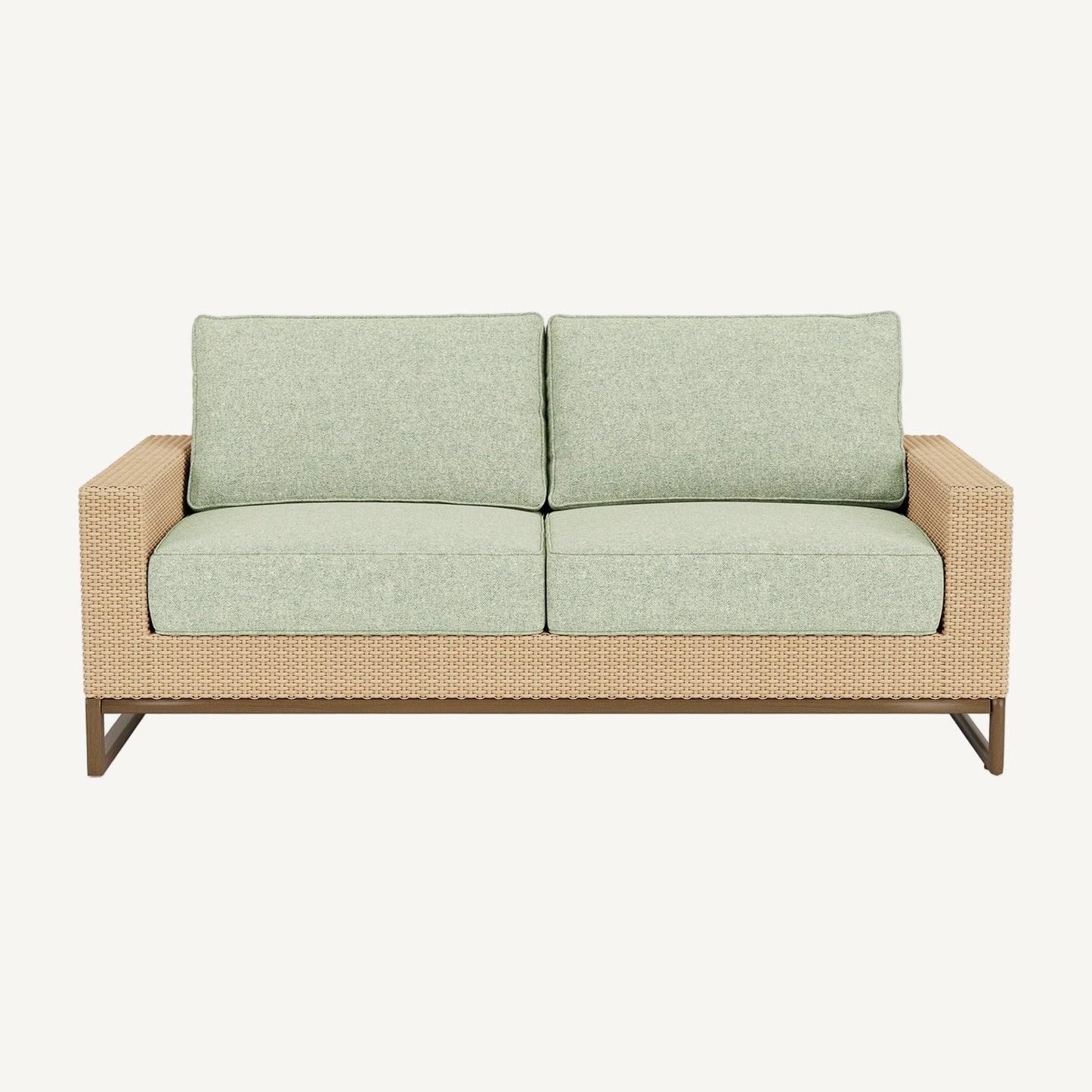 Two-seater outdoor sofa with light green cushions and a wicker frame on a white background