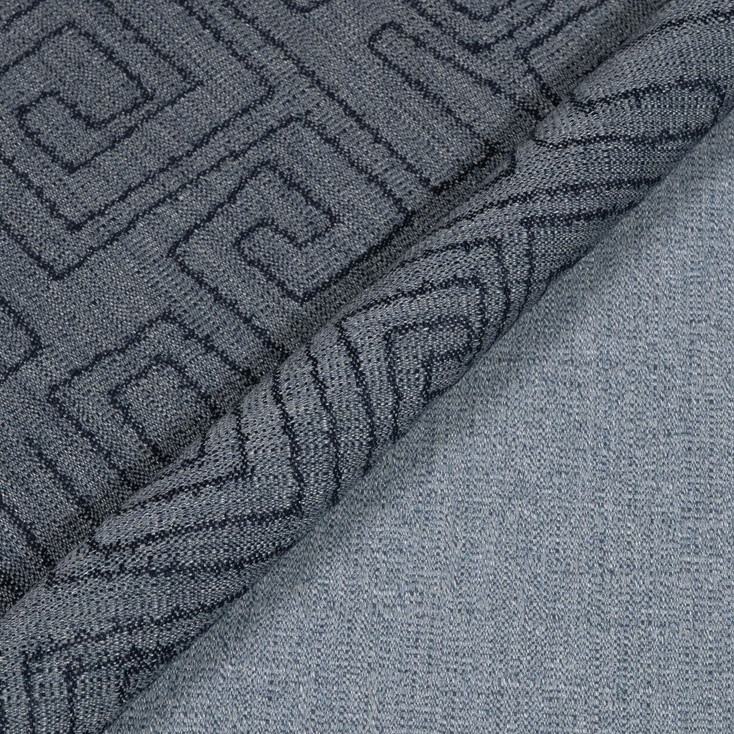 Close-up of textured gray fabric with geometric pattern
