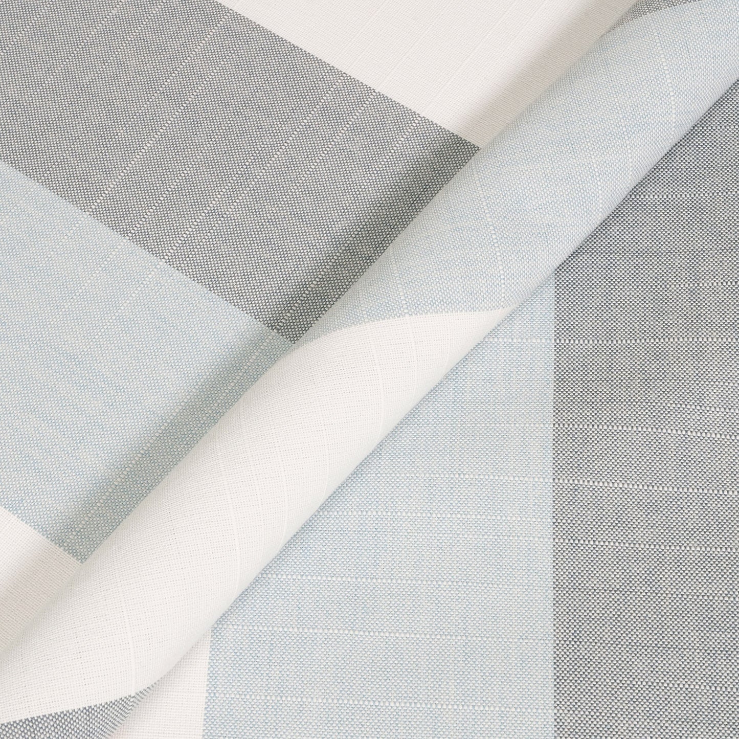 Close-up of fabric swatches in gray, white, and light blue on a white background