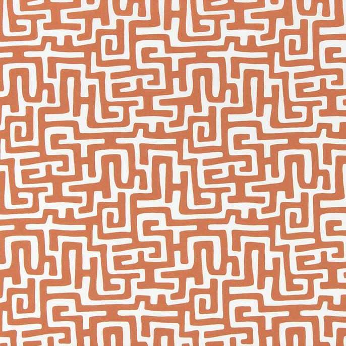 Patterned fabric with white maze-like design on a brown background