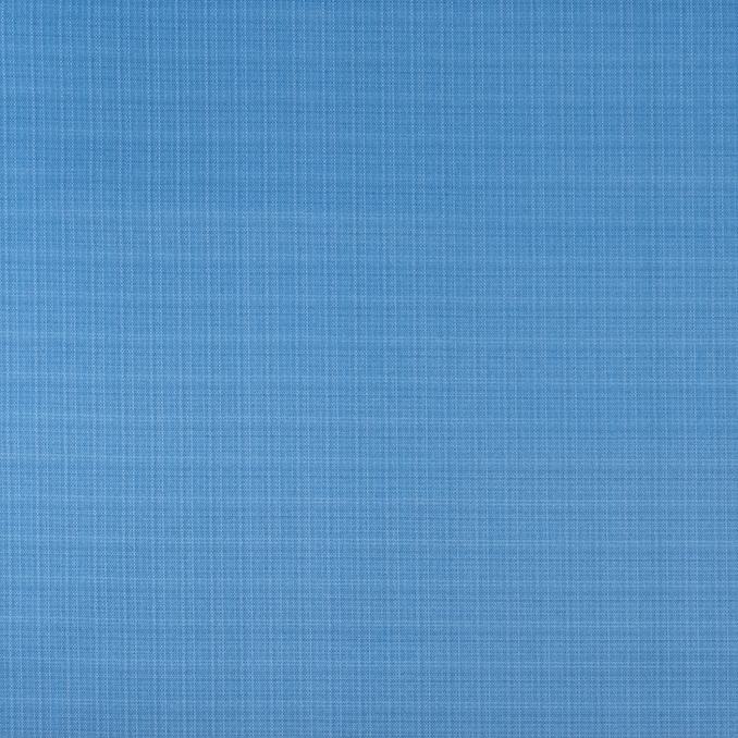 Blue fabric texture with a ruler at the bottom for scale