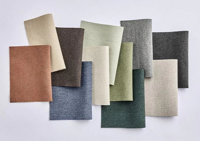 Collection of fabric swatches in various colors on a white background