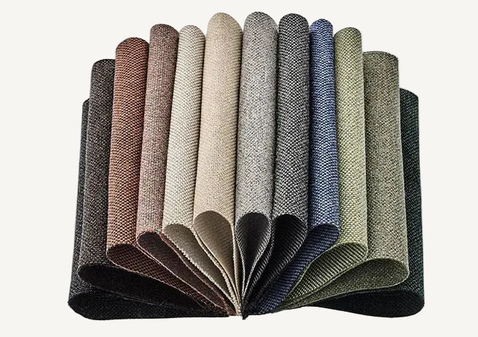 Set of fabric swatches in various colors arranged in a fan-like pattern on a light gray background.