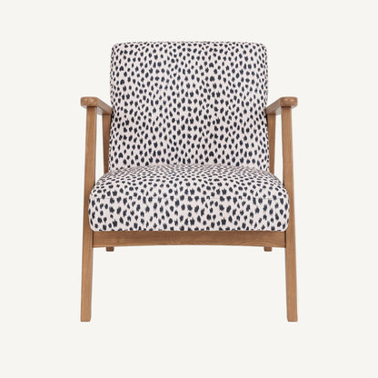 Chair with patterned cushion and wooden frame on a white background