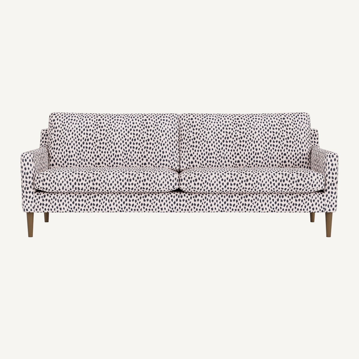 Sofa with a leopard patterned cover on a white background