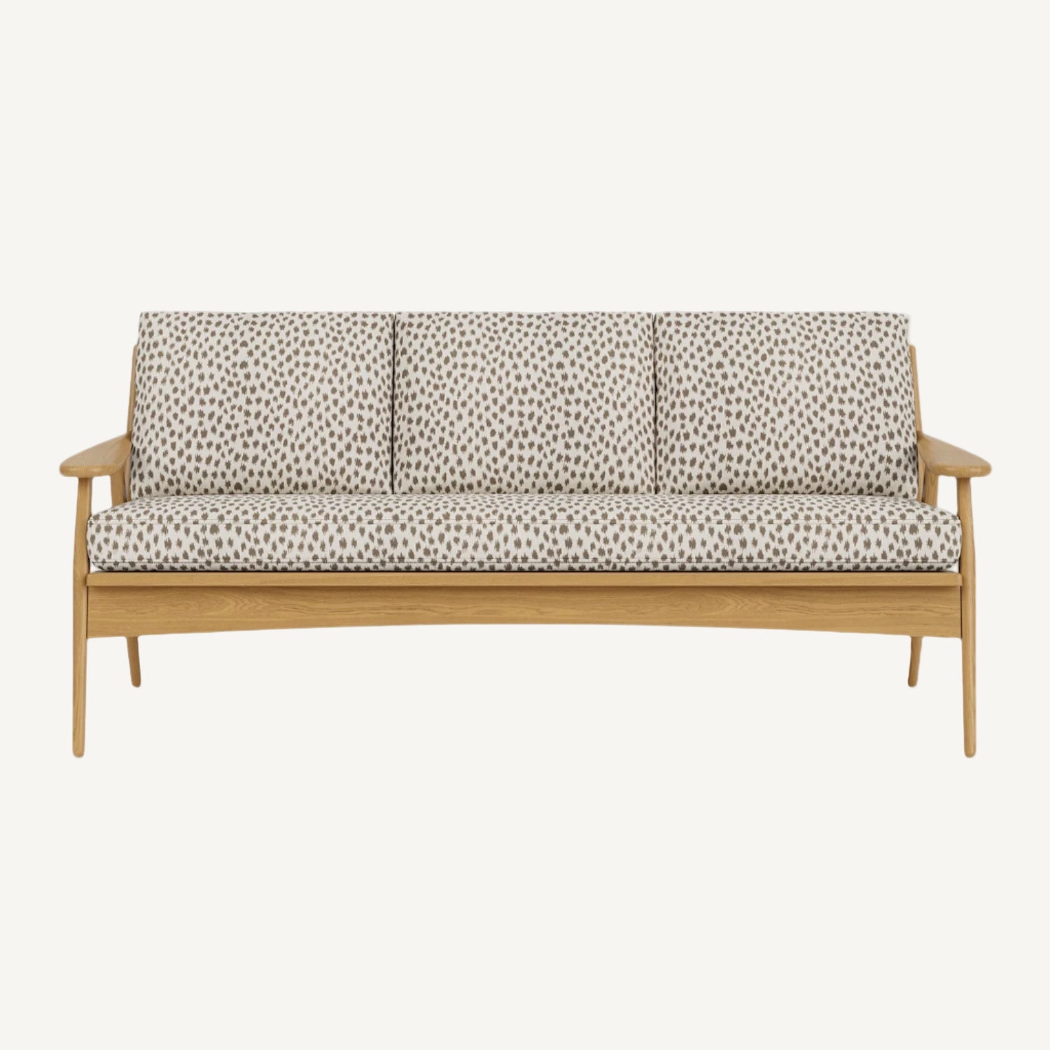 Wooden sofa with patterned cushions on a white background