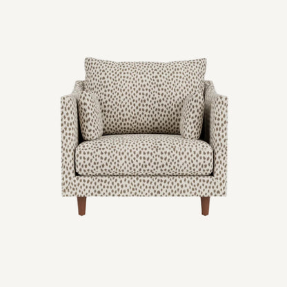 Patterned armchair with a pillow on a white background