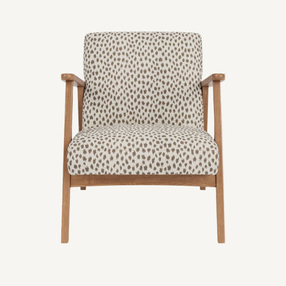 Chair with patterned cushion and wooden frame on a white background