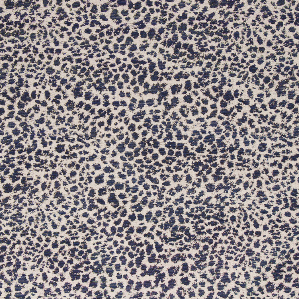 Cheetah Print Indigo Patterned fabric with blue and beige spots on a textured background