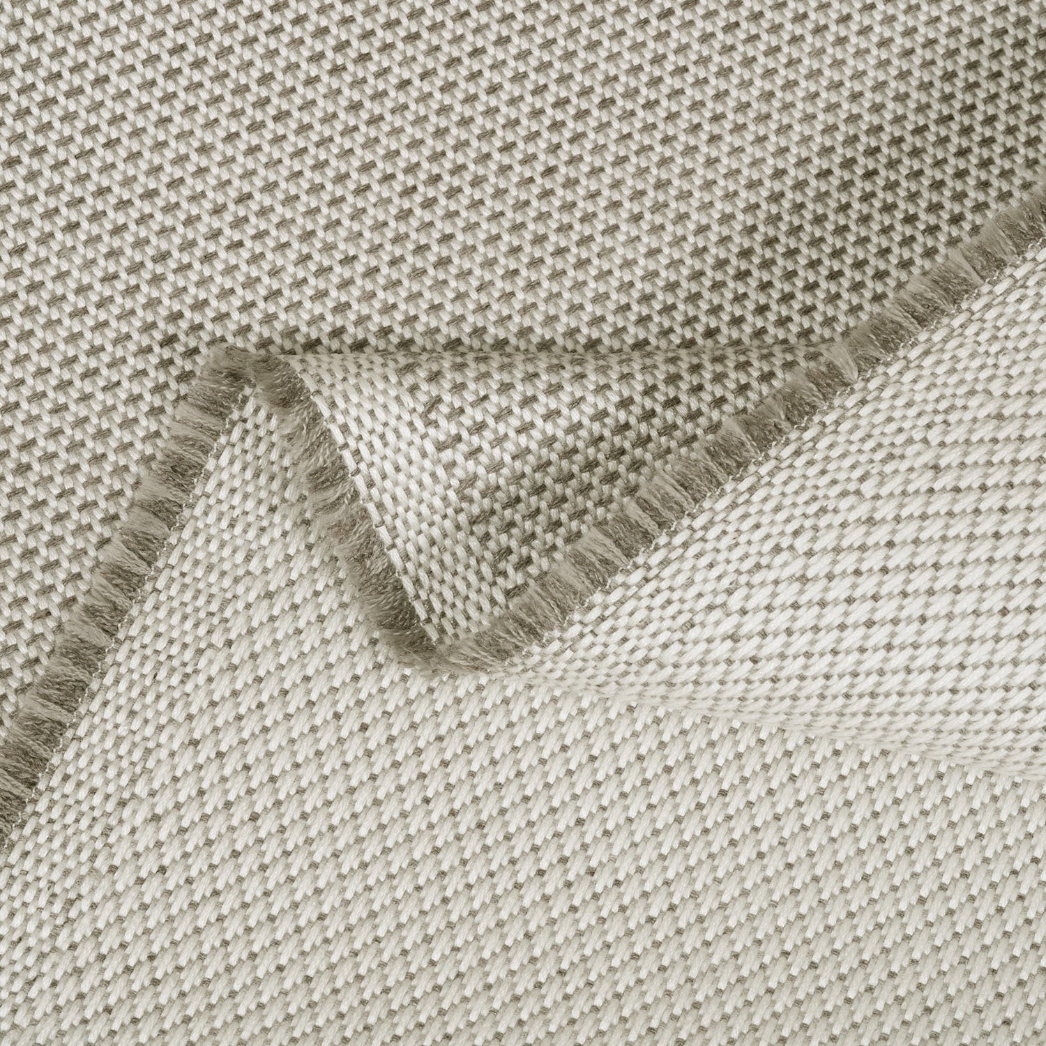 Close-up of a textured fabric with a folded edge