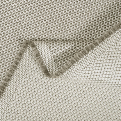 Close-up of a textured fabric with a folded edge