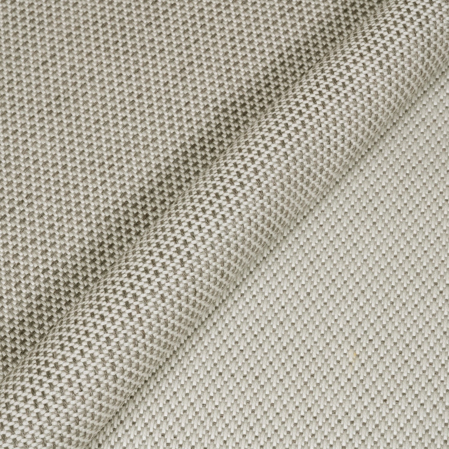 Close-up of textured beige fabric with a subtle pattern