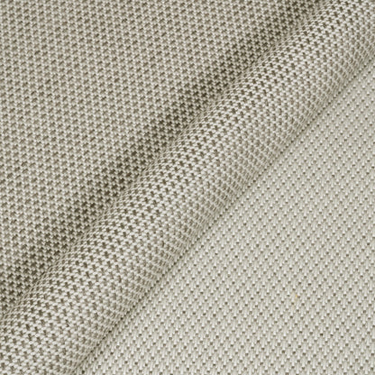 Close-up of textured beige fabric with a subtle pattern