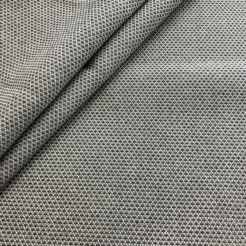 Close-up of gray textured fabric with a diagonal fold