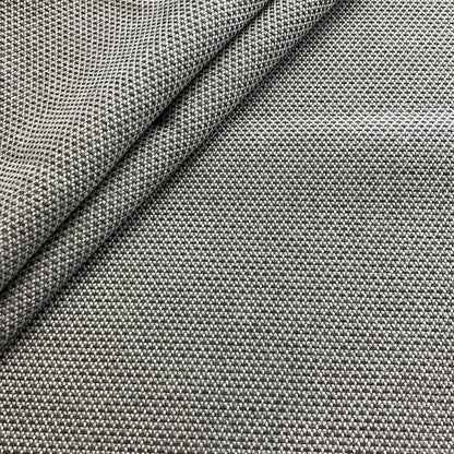 Close-up of gray textured fabric with a diagonal fold
