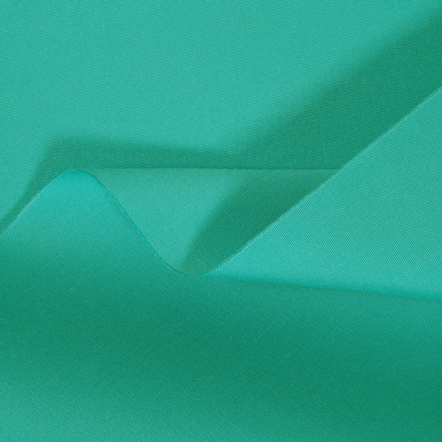 Close-up of teal fabric with a subtle texture
