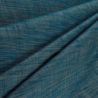 Close-up of blue denim fabric with a subtle pattern