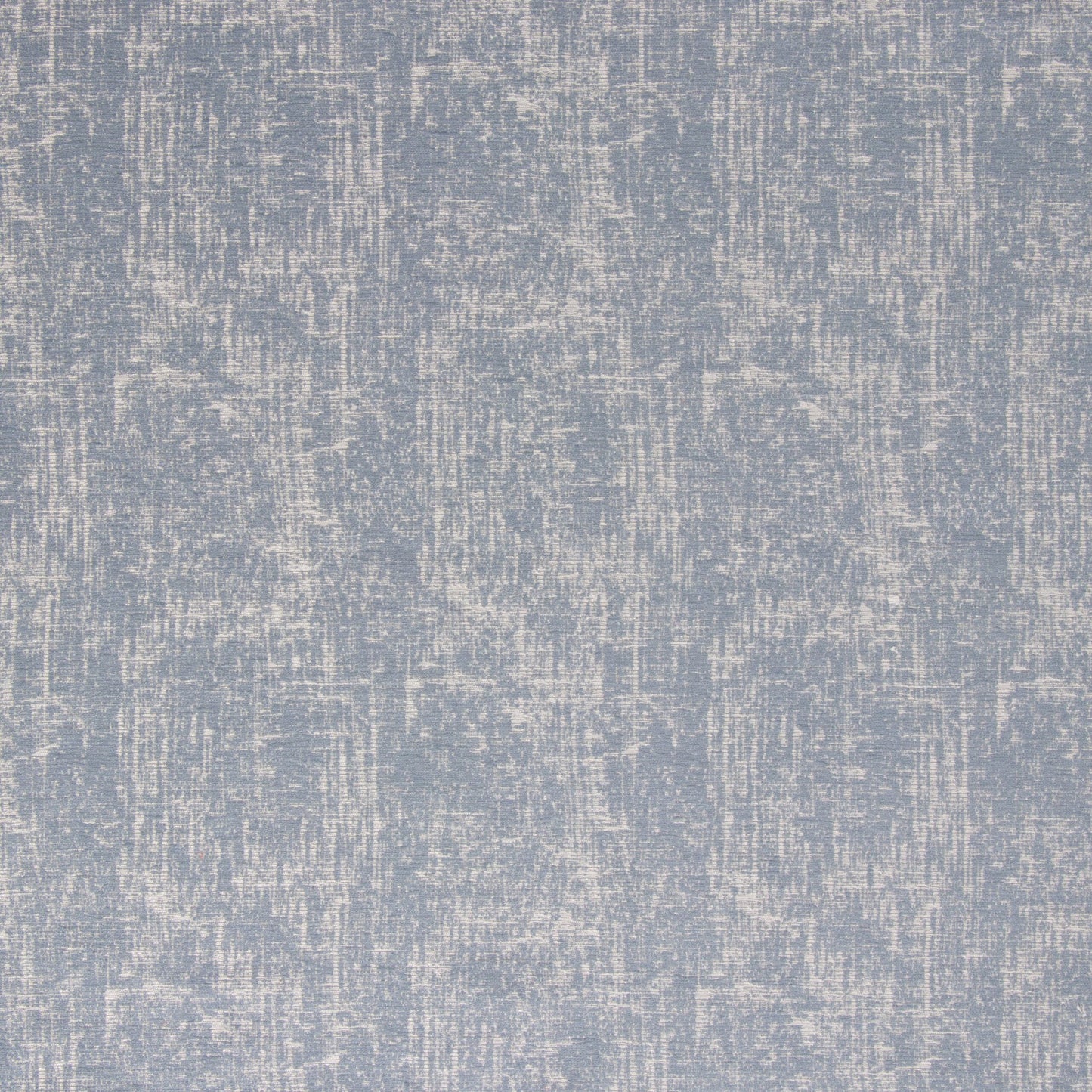 Close-up view of a blue chambray fabric with a textured pattern.