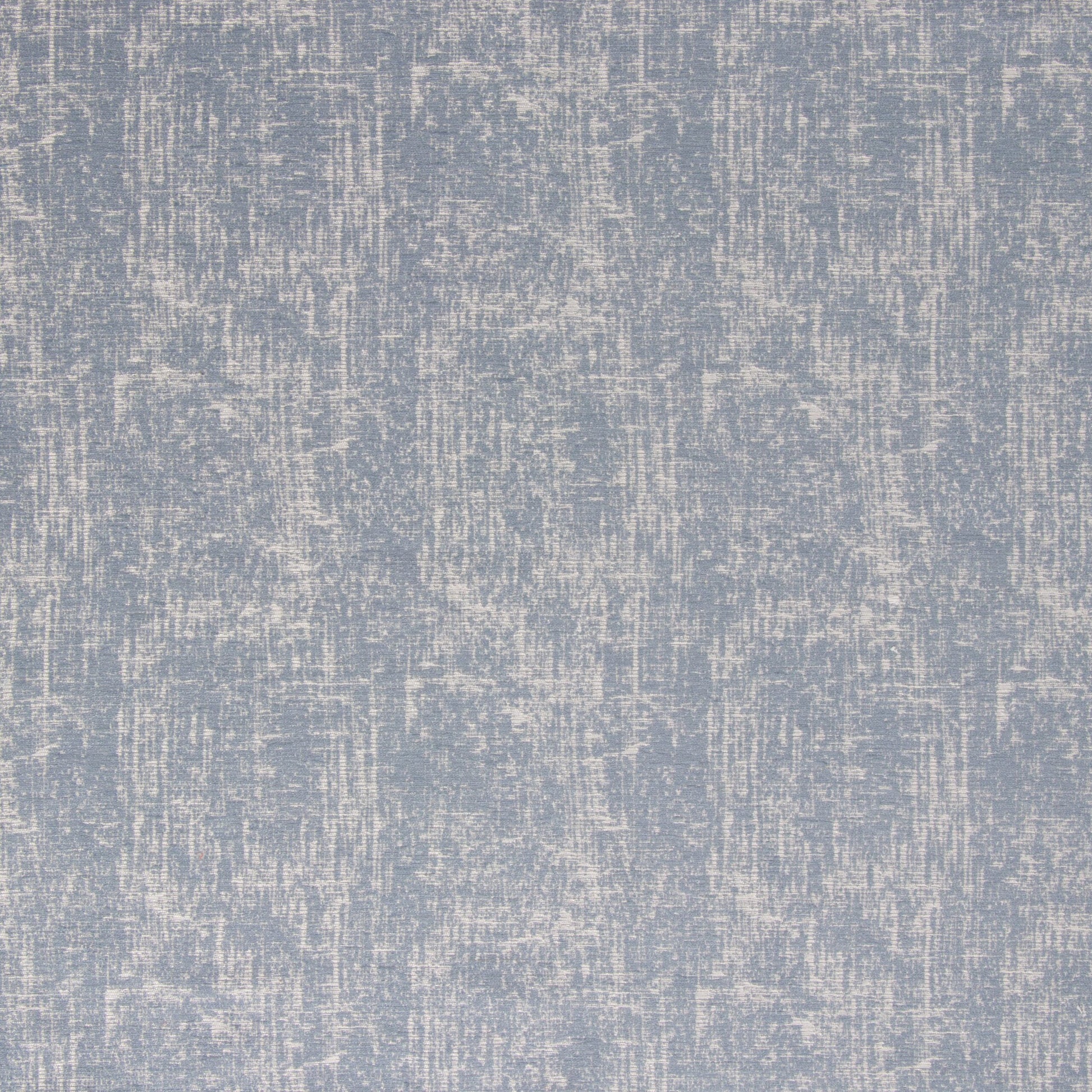 Close-up view of a blue chambray fabric with a textured pattern.