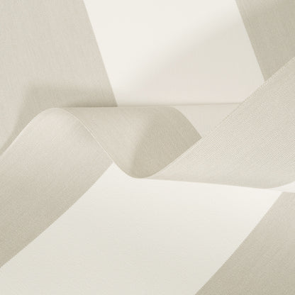 Close-up of beige fabric with a subtle pattern on a white background
