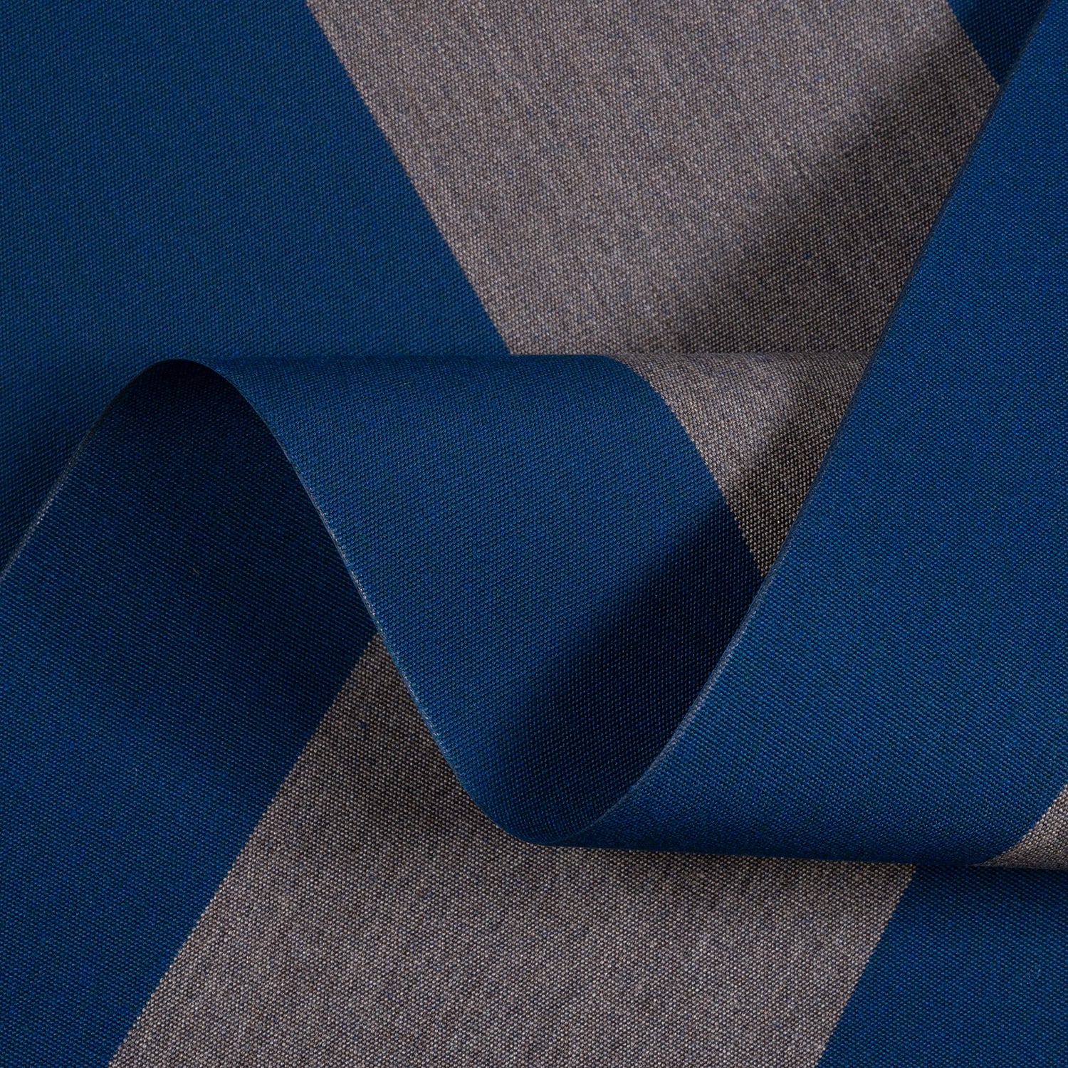 Close-up of blue and gray fabric with a visible pattern