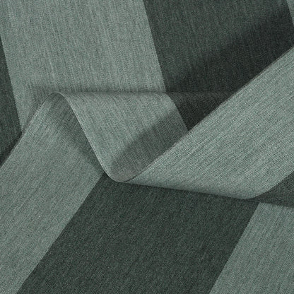 Textured fabric roll with a green and black pattern