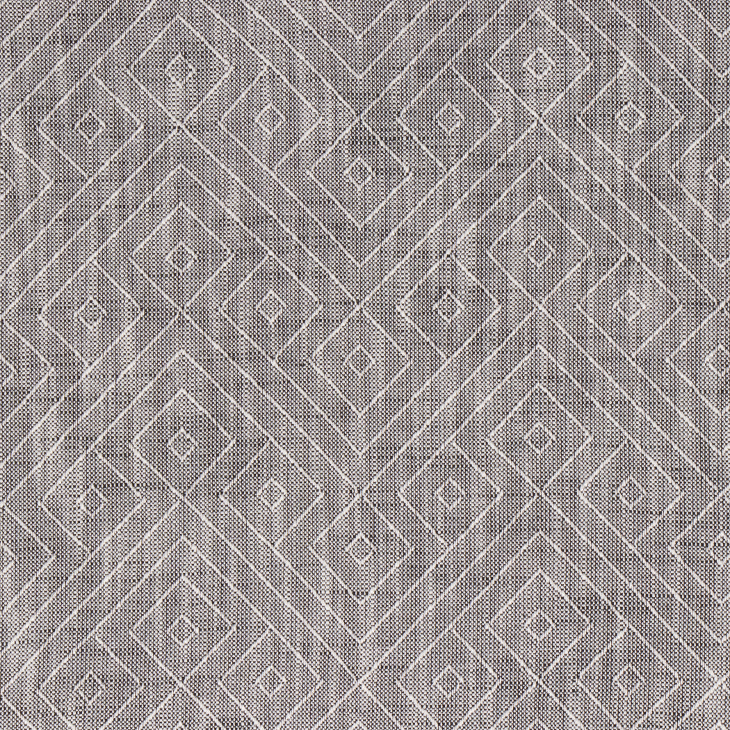 Textured fabric with a geometric diamond pattern in gray and white.