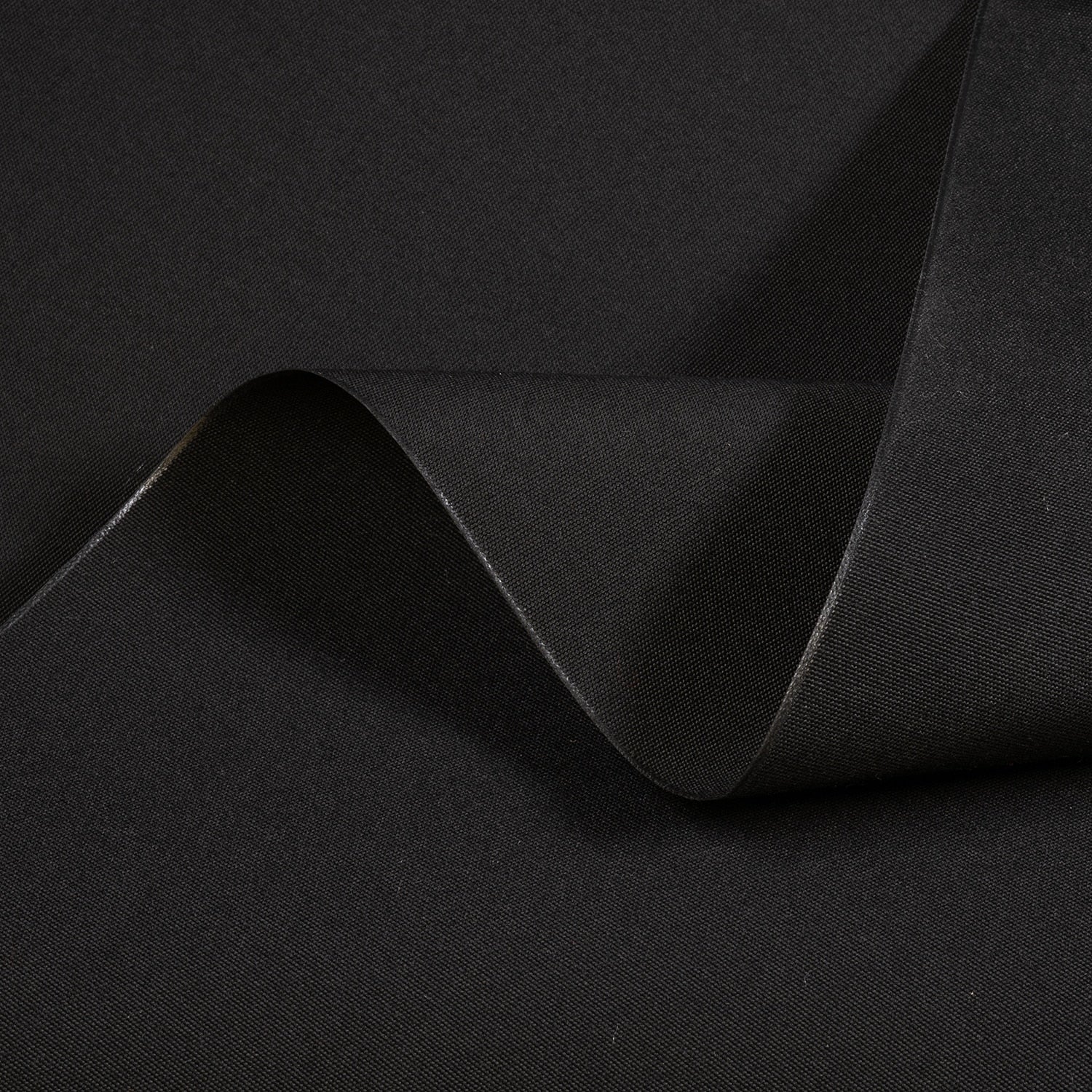 Black fabric with a subtle texture and fold on a black background
