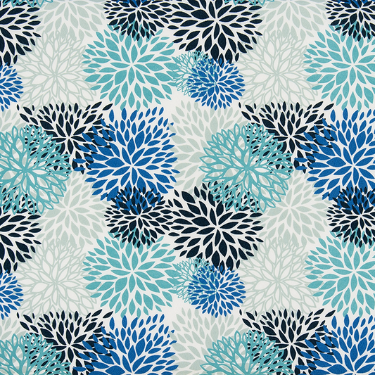 Patterned fabric with blue and black floral designs on a ruler for scale.