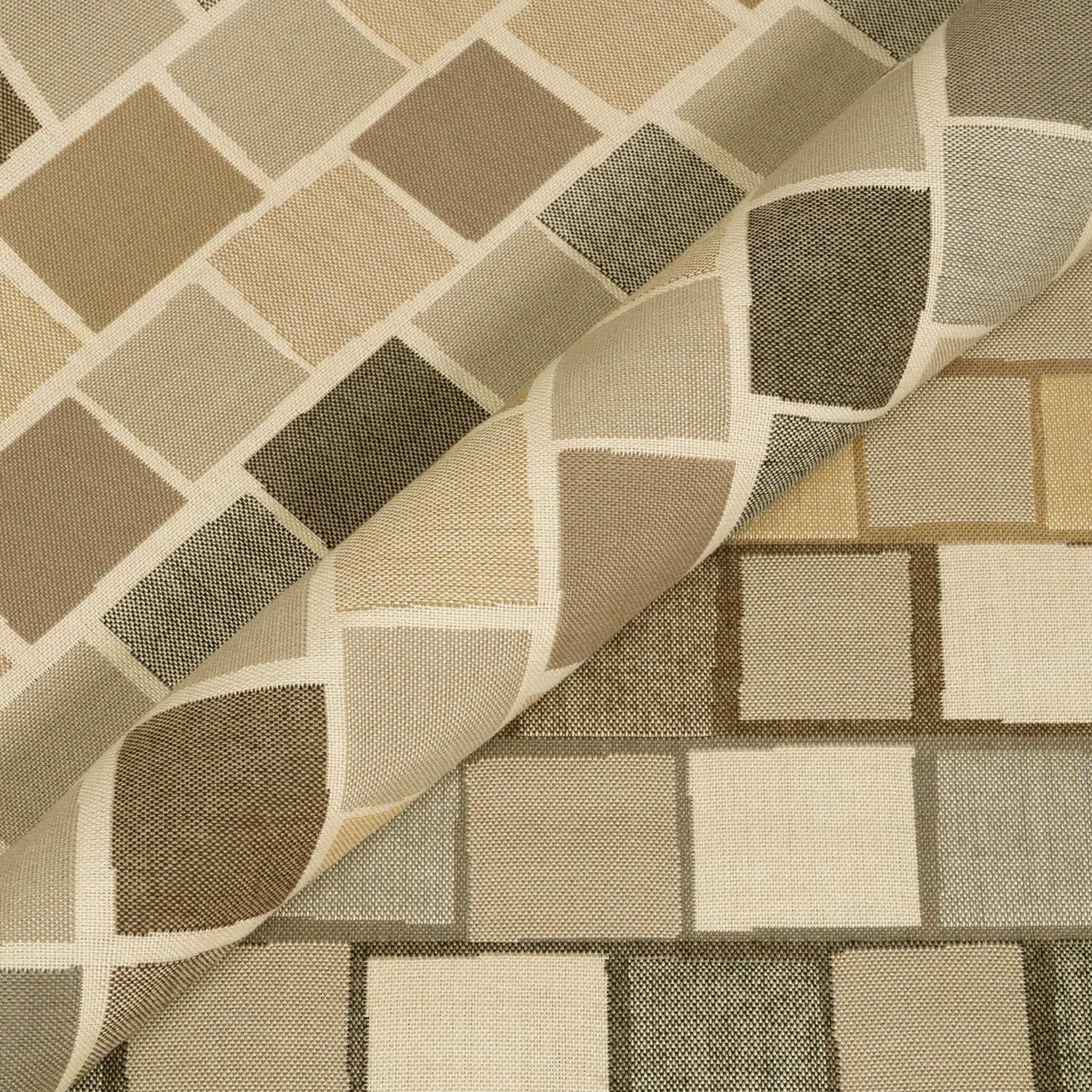 Close-up of patterned fabric with geometric design in beige, brown, and gray.