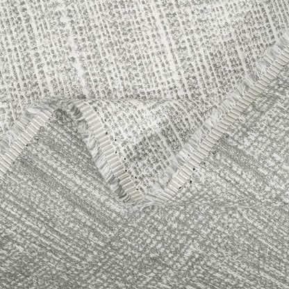 Close-up of textured gray fabric with a subtle pattern