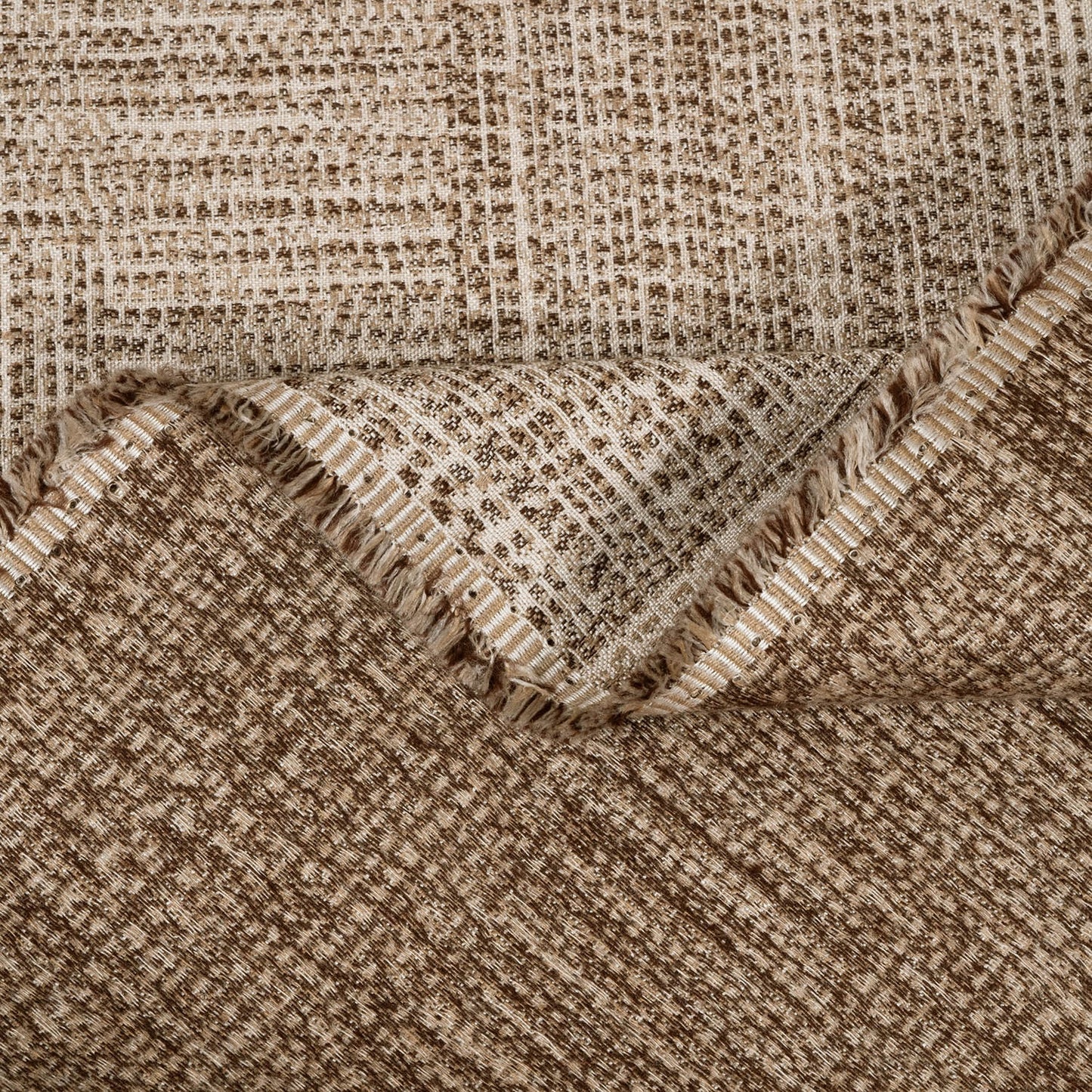 Close-up of a textured fabric with a checkered pattern in brown and beige tones.