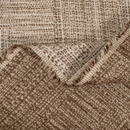 Close-up of a textured fabric with a checkered pattern in brown and beige tones.