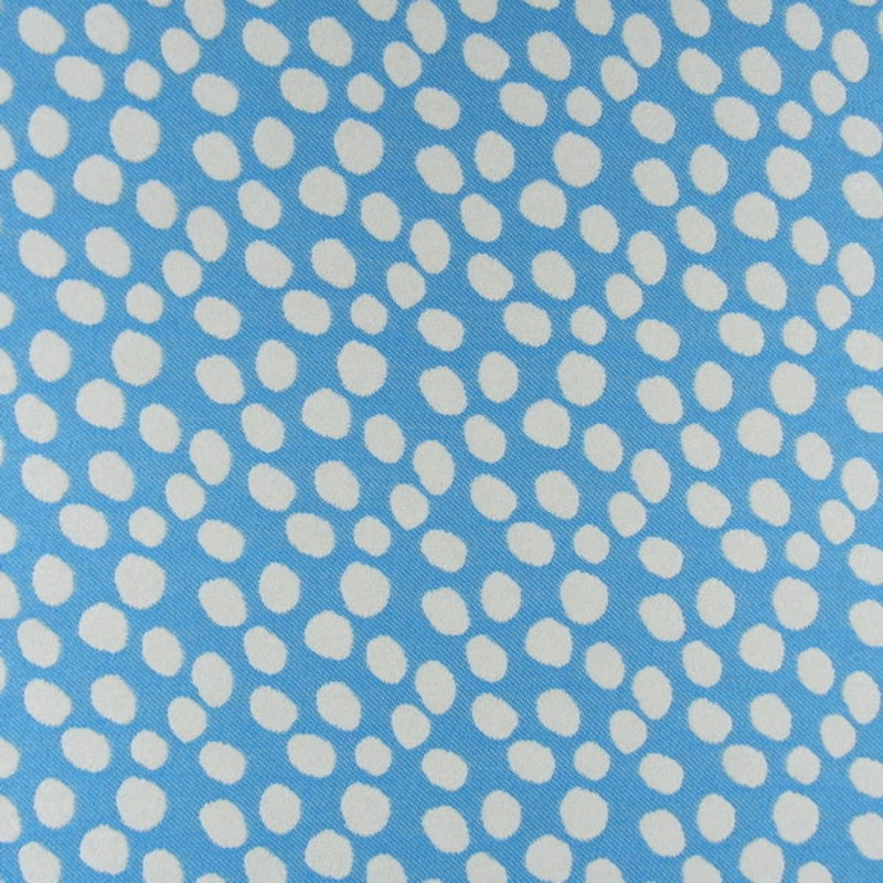 Pattern of white polka dots on a blue background