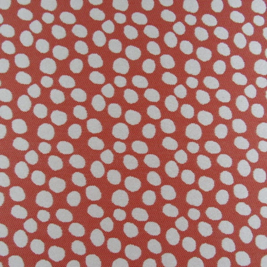 Pattern of white dots on a red background