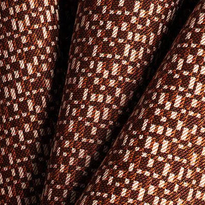 Close-up of brown fabric with a subtle pattern