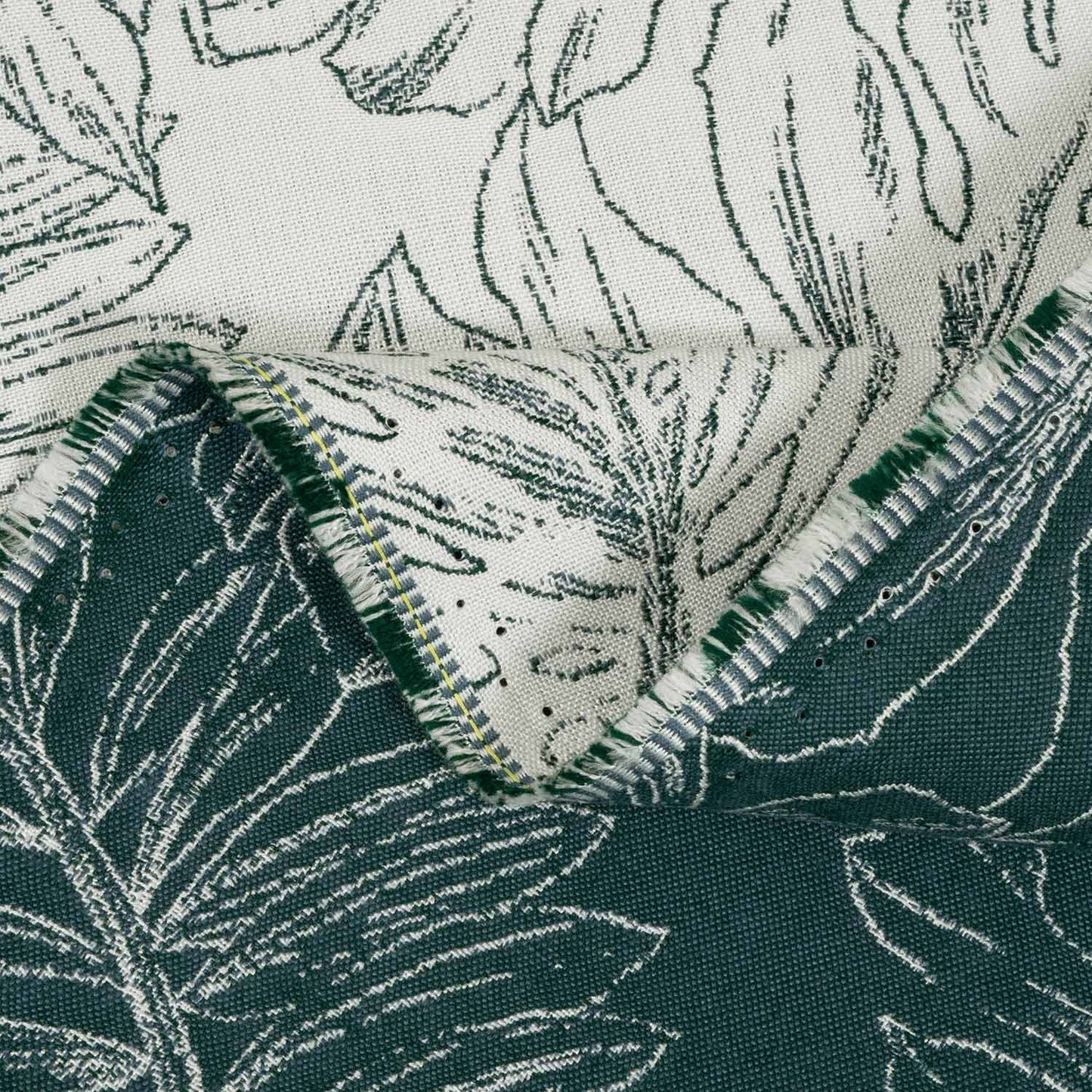 Close-up of fabric with leaf pattern in green and white