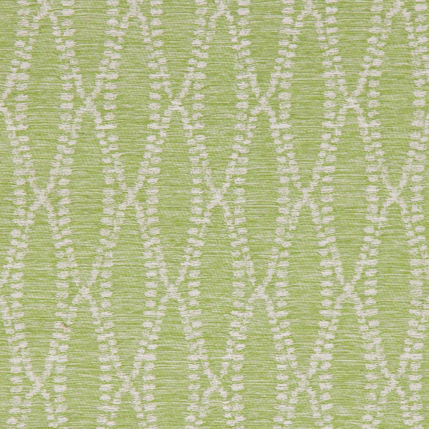 Close-up view of a green fabric with a geometric pattern