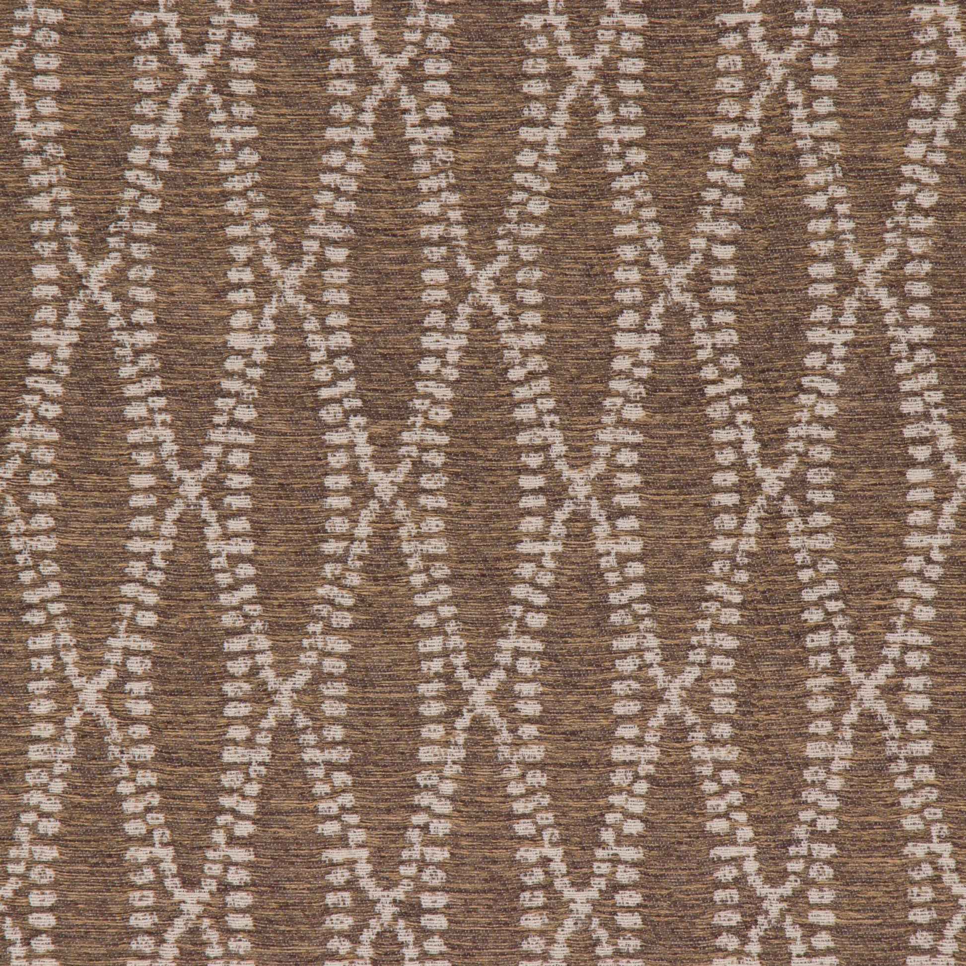 This image displays the "Camber Umber" fabric, showcasing its detailed and textured appearance. The fabric features a geometric pattern composed of intertwined diamond shapes, rendered in a neutral palette of beige and brown tones.