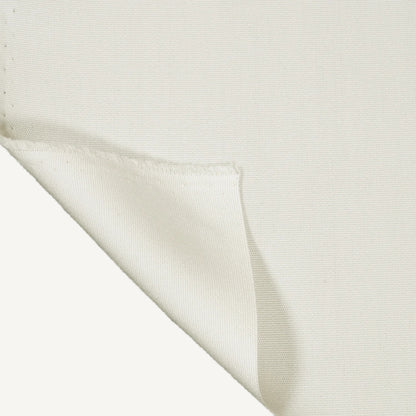 Close-up of white fabric with a subtle pattern on a black background