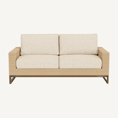Beige outdoor sofa with wicker frame on a white background
