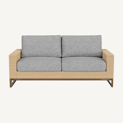 Two-seater outdoor sofa with gray cushions and a wicker frame on a white background