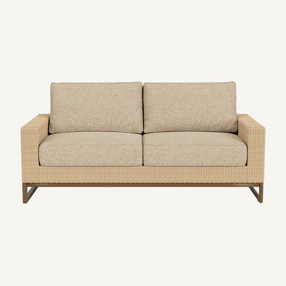 Beige outdoor sofa with wicker frame on a white background