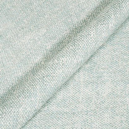 Close-up of a textured light blue fabric surface