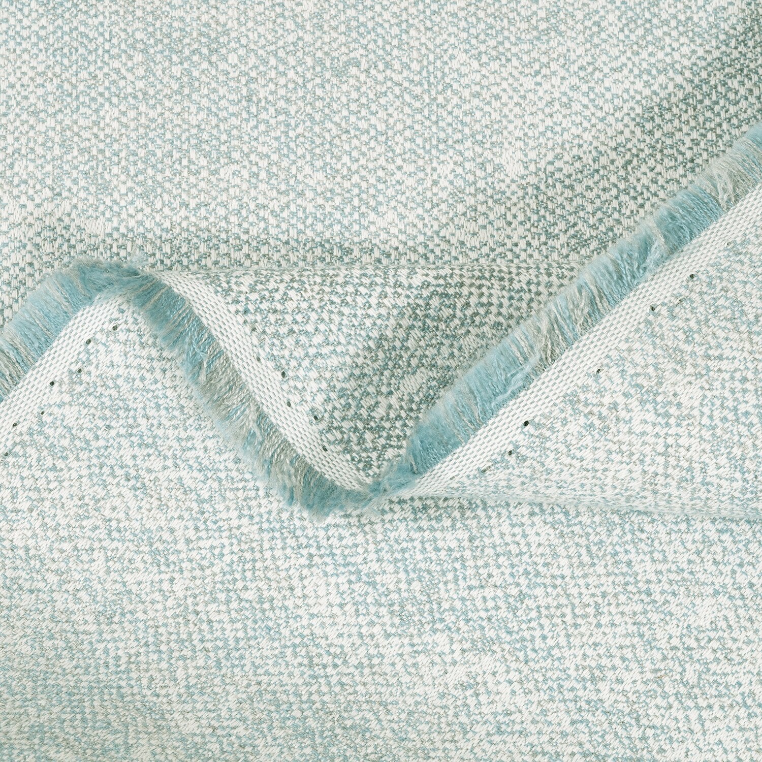Close-up of textured light blue fabric with a wavy edge